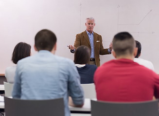 Image showing teacher with a group of students in classroom