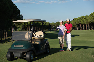 Image showing couple in buggy on golf course