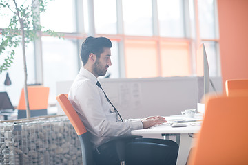 Image showing young business man  working on desktop computer