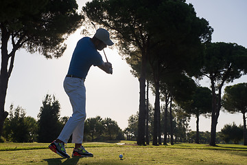 Image showing golf player hitting shot