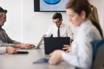 Image showing young business people group on team meeting at modern office