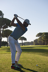 Image showing golf player hitting shot