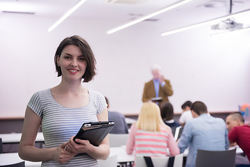 Image showing portrait of happy female student in classroom