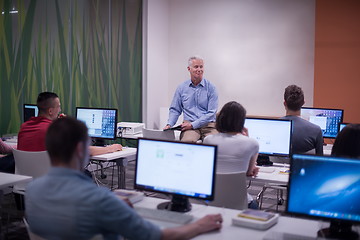 Image showing teacher and students in computer lab classroom