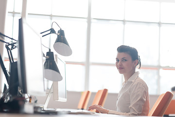 Image showing business woman working on computer at office