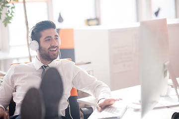 Image showing relaxed young business man at office