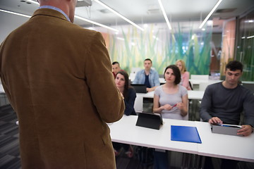 Image showing teacher with a group of students in classroom