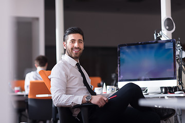 Image showing young business man  working on desktop computer