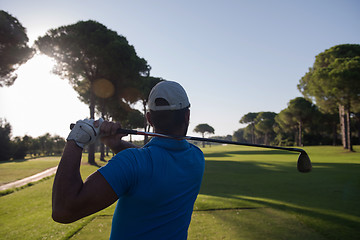 Image showing golf player hitting shot