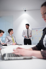 Image showing young business woman on meeting  using laptop computer