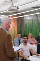 Image showing teacher with a group of students in classroom