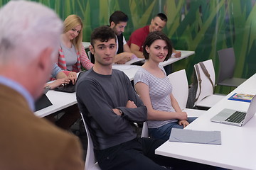 Image showing teacher with a group of students in classroom