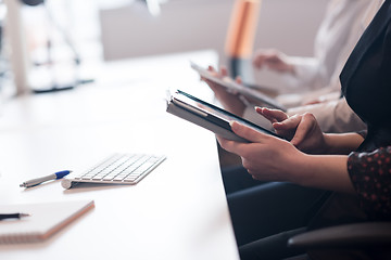 Image showing business people on meeting  using tablet