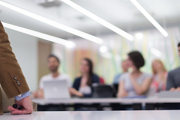 Image showing close up of teacher hand while teaching in classroom