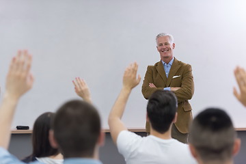 Image showing teacher with a group of students in classroom