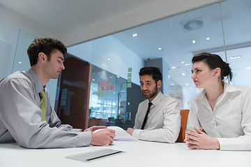 Image showing young couple signing contract documents on partners back