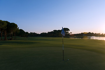 Image showing golf ball on edge of  the hole