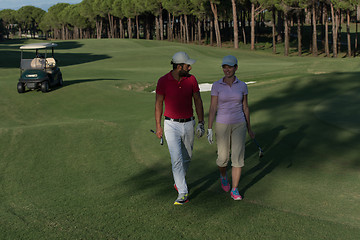 Image showing couple walking on golf course