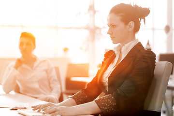 Image showing business woman at  office people group on meeting  in background