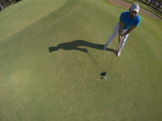 Image showing top view of golf player hitting shot