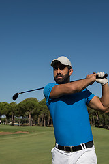 Image showing golf player hitting shot