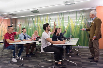 Image showing teacher with a group of students in classroom