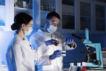 Image showing close up of scientists making test in lab