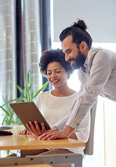 Image showing happy creative team with tablet pc in office