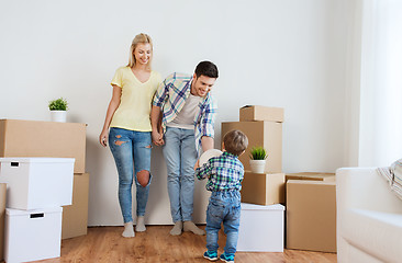 Image showing happy family moving to new home and playing ball