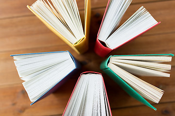 Image showing close up of books on wooden table