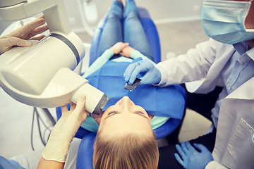 Image showing dentist and patient with dental x-ray machine