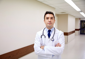 Image showing doctor with stethoscope at hospital corridor