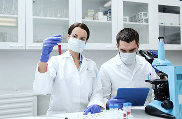 Image showing young scientists making test or research in lab