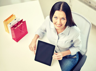 Image showing close up of woman with tablet pc at office