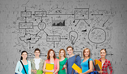 Image showing group of teenage students with folders and bags