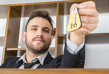 Image showing Receptionist Giving the Key