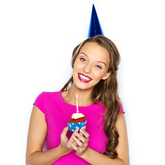 Image showing happy woman or teen girl with birthday cupcake