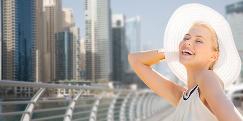 Image showing happy woman enjoying summer over dubai city