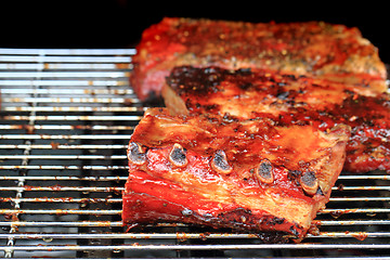 Image showing pork ribs on the grill