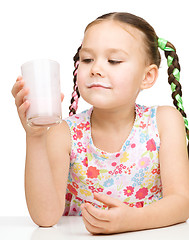 Image showing Cute little girl showing milk moustache