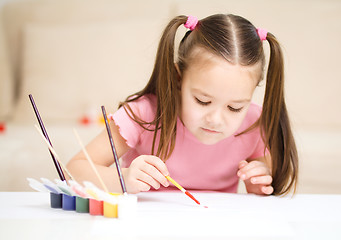 Image showing Cute cheerful child play with paints