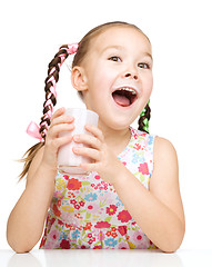 Image showing Cute little girl with a glass of milk