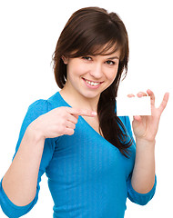 Image showing Young woman is holding visit card