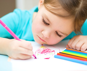 Image showing Cute cheerful child drawing using felt-tip pen