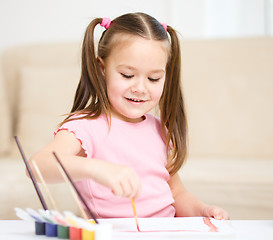 Image showing Cute cheerful child play with paints