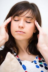 Image showing Woman is suffering headache