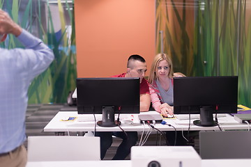 Image showing teacher and students in computer lab classroom