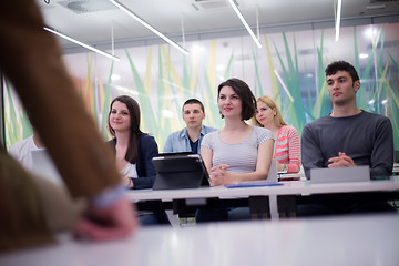 Image showing teacher with a group of students in classroom