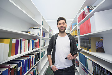 Image showing student with tablet in library