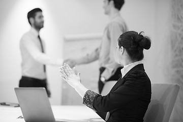 Image showing young business woman on meeting  using laptop computer